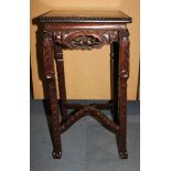 A Chinese rosewood stand, late 19th/early 20th Century, the square top with beaded rim, the apron