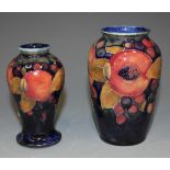 A Moorcroft pottery vase, 1918-1929, of high shouldered tapering form decorated with pomegranate