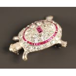 A diamond and ruby set brooch, designed as a tortoise, mounted with two rectangular cut rubies in an