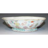 A Chinese famille rose porcelain bowl, mid-19th Century, of shallow shaped oval form, the exterior