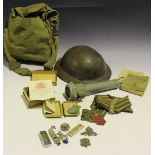 A collection of Second World War period militaria, including a non-magnetic helmet, cloth rank