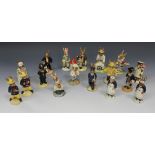 A collection of seventeen Royal Doulton Bunnykins figures, comprising two 'Fireman', DB75, two '