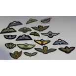 A collection of twelve cloth parachute wing badges, mainly unused, two glider pilot wings, four