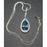 An 18ct white gold, aquamarine and diamond set drop shaped pendant, mounted with the pear shaped