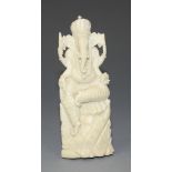 An Indian carved ivory figure of Ganesh, early 20th Century, modelled in a seated pose, height