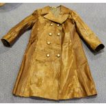 A mid-20th Century brown hide three-quarter length coat with gilt metal double-breasted buttons,