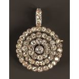 A diamond set pendant brooch in a circular design, mounted with cushion shaped diamonds with the