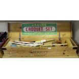 A Jaques croquet set within a pine case, width approx 107cm.