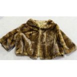 A mid-20th Century brown fur short coat, the interior bearing label marked 'Leveson London' and