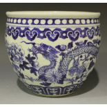 A Chinese blue and white porcelain small jardinière, late 19th Century, painted with dragons