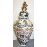 A large Japanese Imari porcelain jar and cover, 19th Century, the ovoid body painted with a