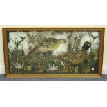 An early 20th Century feather picture of two pheasants in a stylized grassy surround, approx 45cm