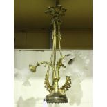 An early 20th Century gilt cast metal three branch ceiling light, fitted with frosted glass