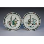 A pair of Chinese famille verte porcelain saucer dishes, Kangxi period, each of fluted circular