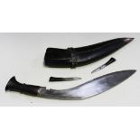 A kukri knife with curved single edged blade, length approx 33cm, worn maker's mark at forte,