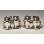 A pair of Victorian silver cruets, each fitted with a pepper and mustard of coopered barrel form,