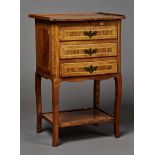 A Louis XV provincial kingwood and fruitwood bedside chest of three drawers with overall crossbanded