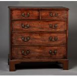 A George III mahogany chest of two short and three long graduated drawers with applied gilt cast