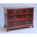 An Edwardian mahogany chest of two short and two long drawers, on splayed bracket feet, height
