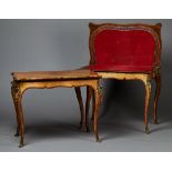 A pair of mid-Victorian burr walnut fold-over card tables, possibly by Gillows of Lancaster, with