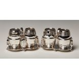 A pair of Victorian silver cruets, each fitted with a pepper and mustard of coopered barrel form,