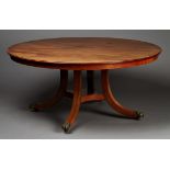 A late 20th Century George III style mahogany circular dining table, fitted with five additional