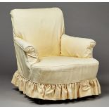 A mid-Victorian scroll armchair with loose cotton covers, the turned walnut front legs with brass