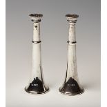 A pair of silver novelty pepper casters, each modelled as a hunting horn, Sheffield 1936 by Walker &