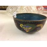 A Japanese cloisonne bowl with dragon chasing flaming pearl decoration. 11cm diameter.