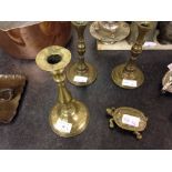 3 brass candlesticks and a brass tortoise.