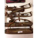 2 pairs of vintage ice skates.