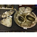 A quantity of silver plated items including cruet set and tea set.