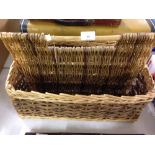 A wicker basket/magazine rack