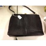 A vintage Mappin & Webb black lizard skin handbag with matching purse.