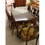 Extending dining room table with carved legs & 6 chairs (4 + 2 carvers) walnut.136 x 84cm (