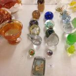 12 glass paperweights to include Mdina and a Vitamine Malt advertising example.