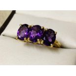 Gold plated 925 silver ring set with 3 large oval cut amethysts. Size Q½.