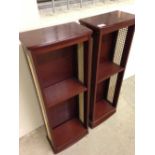 A pair of dark wood and cane shelving units. Each 82 x 30 x 17cm.