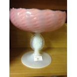 A moulded glass tazza with pink bowl & vaseline glass stem inset with a portrait of a classical