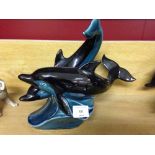 A Poole Pottery pair of entwined dolphins