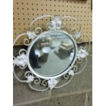 A round mirror with metal white ivy leaf decoration. 38cm diameter.