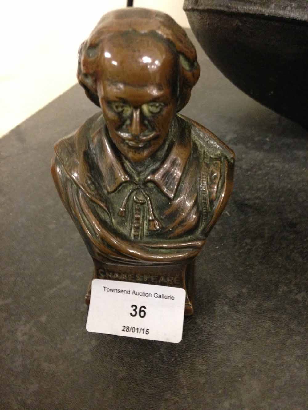 A miniature metal bust of William Shakespeare