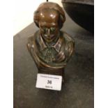 A miniature metal bust of William Shakespeare