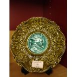 An antique majolica dish with portrait to centre, possibly Rubelles