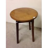 A small circular sycamore topped table. 50cm diameter.