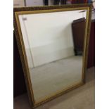 A large gilt framed mirror 112x86cm