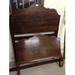 A vintage single bed - with mahogany headboard & foot, metal frame.