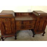 A Victorian sideboard with ball & claw feet.