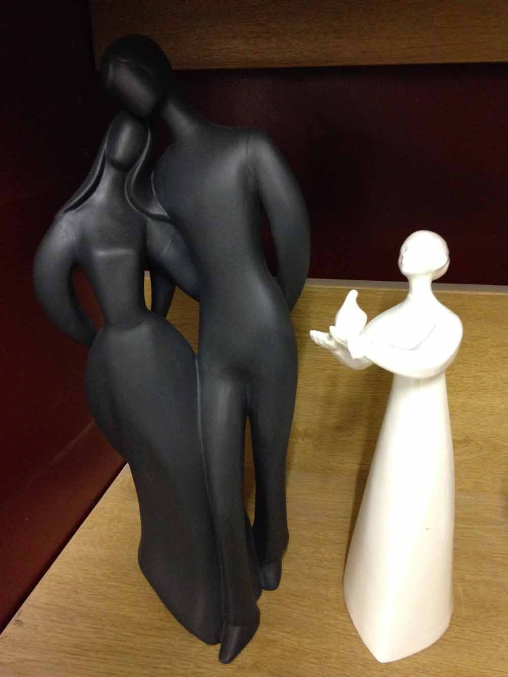 A Royal Doulton black basalt figure 'Lovers' HN2783 together with a Royal Doulton blanc de chine '