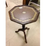 A leather topped wine table.